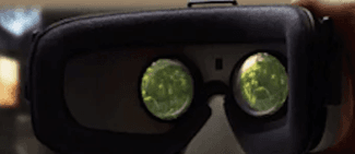 Close-up of a virtual reality headset with green-tinted lenses.